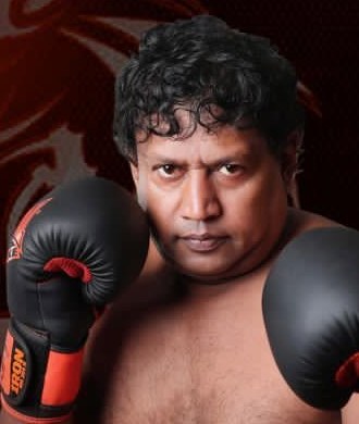 Master Wasantha Senarathne in boxing gloves – kickboxing classes in Kandy, Sri Lanka